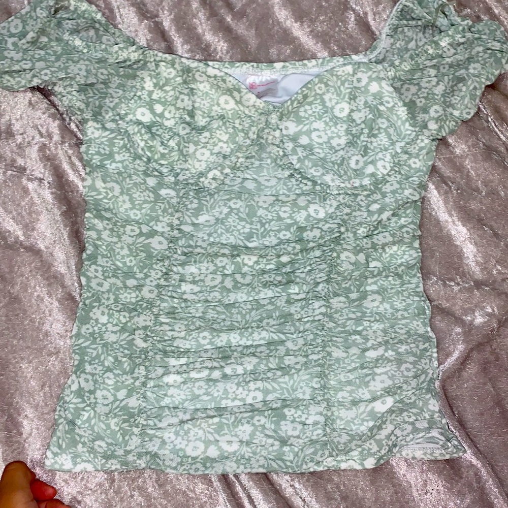 Green ditsy floral top with short sleeves
